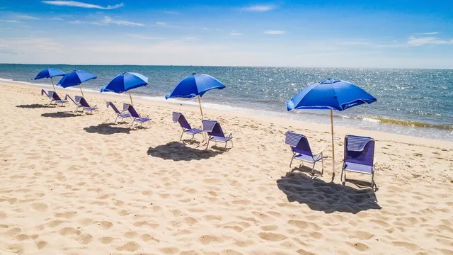 an aerial view of a golf course with chairs