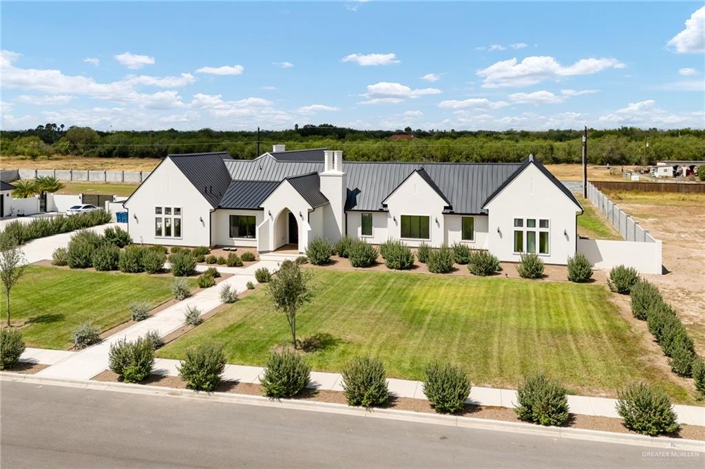 1215 Chelsea Drive Palmhurst, TX 78573 - Photo 1 of 30 a view of house with garden