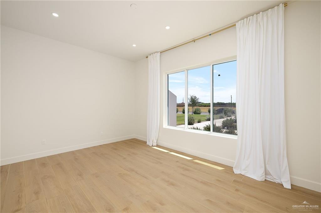 1215 Chelsea Drive Palmhurst, TX 78573 - Photo 16 of 30 an empty room with a window