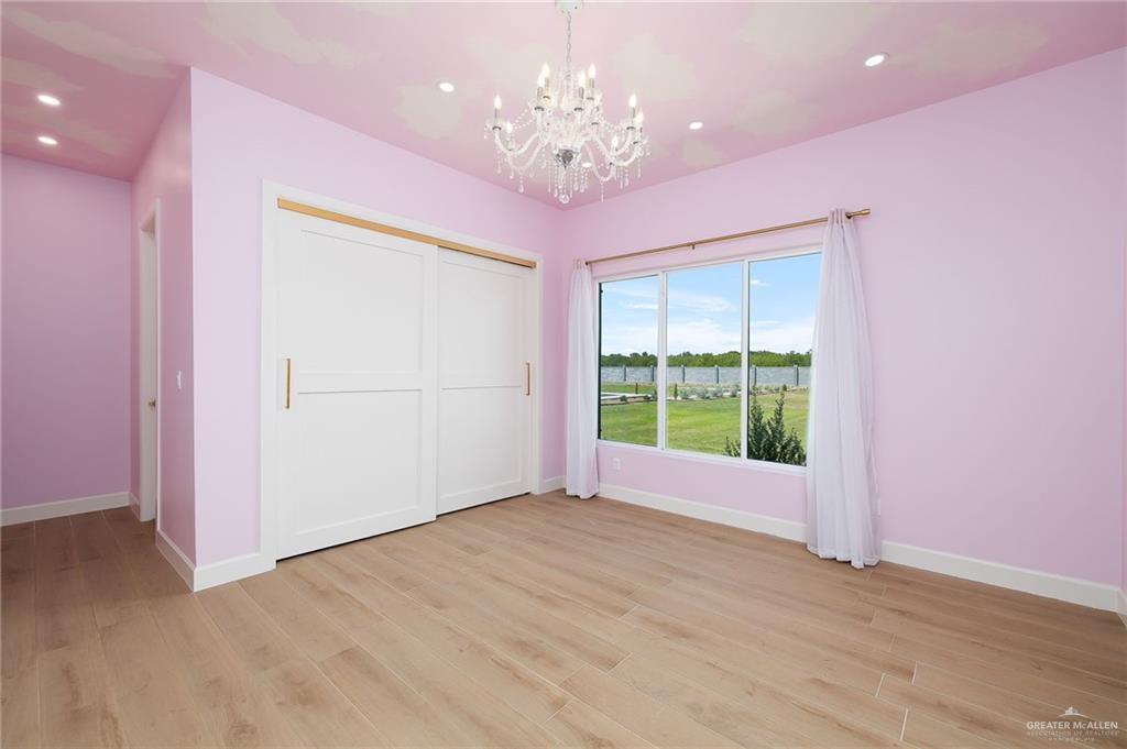 1215 Chelsea Drive Palmhurst, TX 78573 - Photo 19 of 30 a view of an empty room with a window