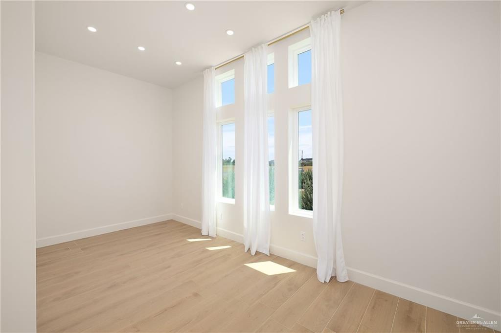 1215 Chelsea Drive Palmhurst, TX 78573 - Photo 24 of 30 an empty room with windows