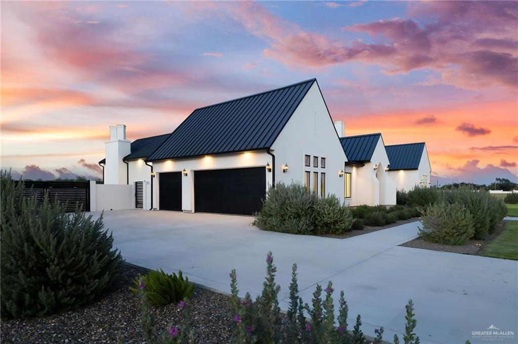 1215 Chelsea Drive Palmhurst, TX 78573 - Photo 25 of 30 a front view of a house with a yard and trees
