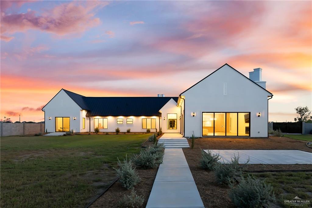 1215 Chelsea Drive Palmhurst, TX 78573 - Photo 26 of 30 a front view of a house with a yard