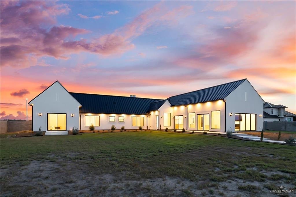 1215 Chelsea Drive Palmhurst, TX 78573 - Photo 27 of 30 a front view of a house with a yard