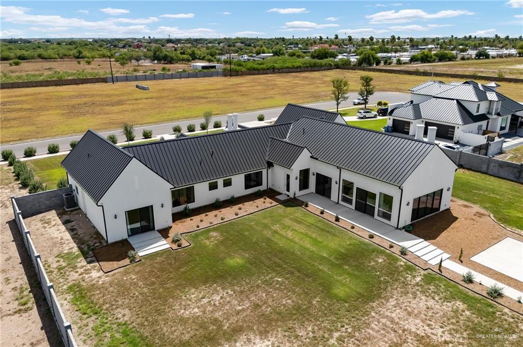 1215 Chelsea Drive Palmhurst, TX 78573 - Photo 28 of 30 a view of a house with pool and ocean view