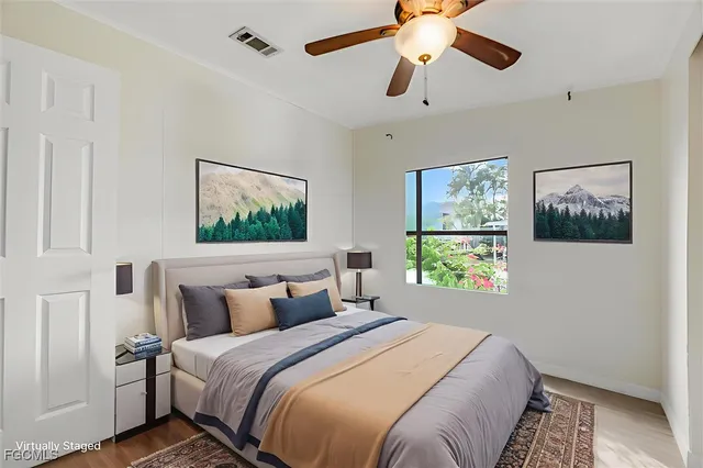 a bathroom with a sink a toilet and shower curtain