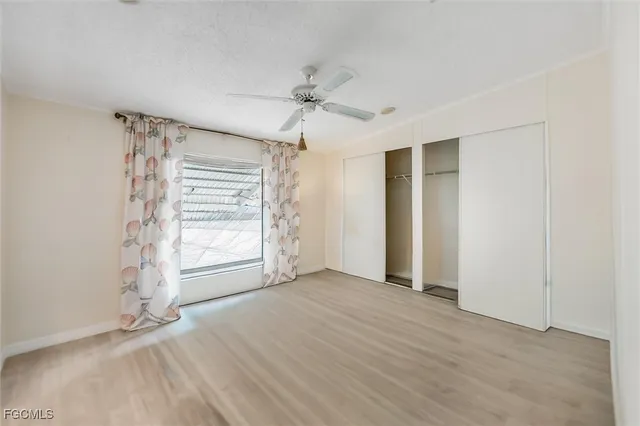 a bedroom with a bed and a chair