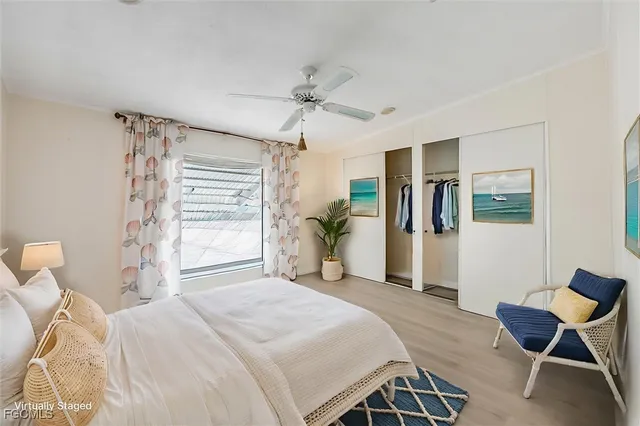an empty room with a ceiling fan and entryway