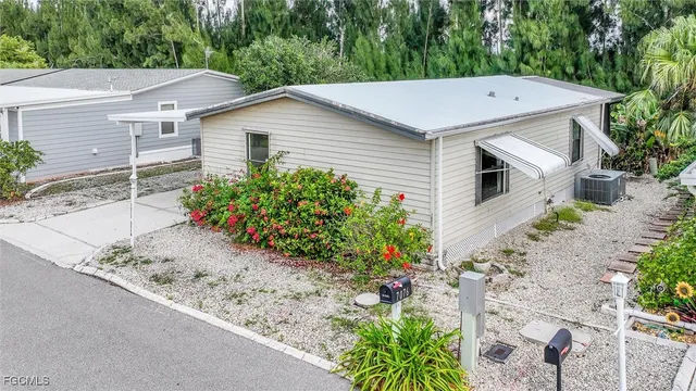 a aerial view of a house with a yard and potted plants