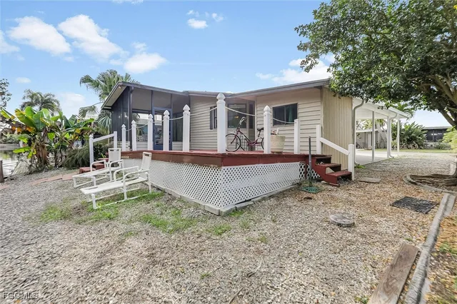 a view of a house with wooden deck