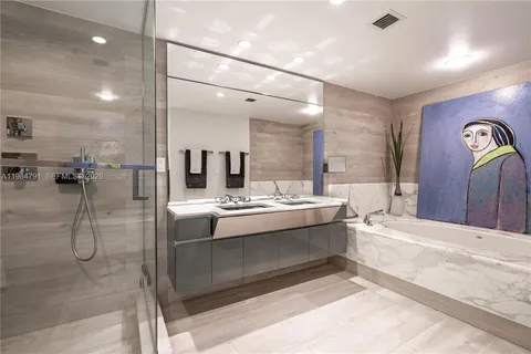 a view of a bathroom with a tub sink and mirror