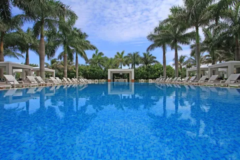 a swimming pool with outdoor seating and yard