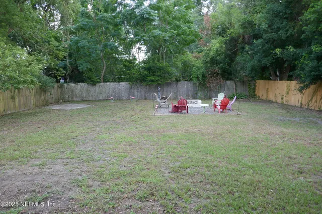 a view of backyard with space and deck