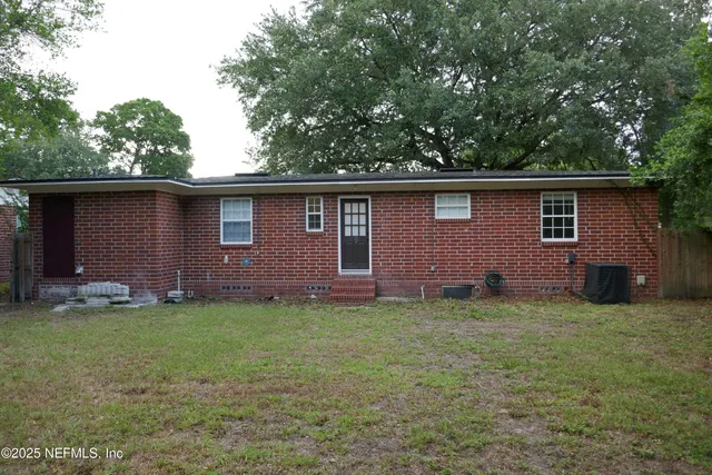 a backyard of a house with lots of green space