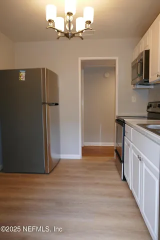 a view of a kitchen with a sink and dishwasher