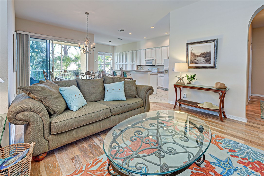 604 Ravinia Circle, Unit 604 Venice, FL 34292 - Photo 12 of 37 a living room with furniture and a large window