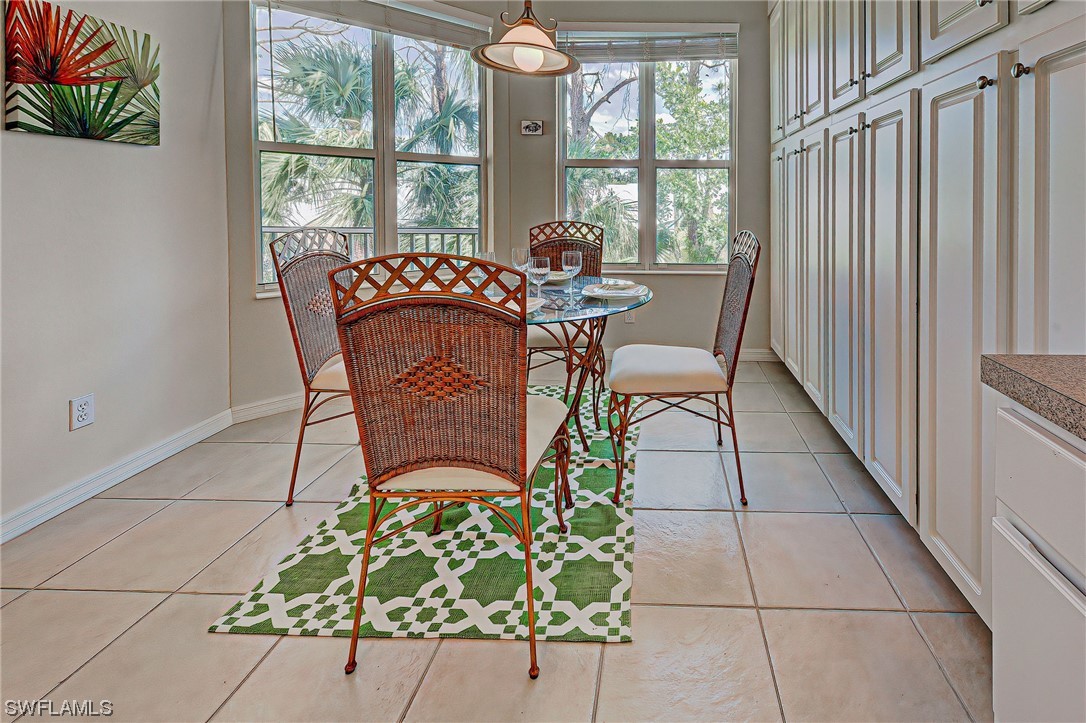 604 Ravinia Circle, Unit 604 Venice, FL 34292 - Photo 18 of 37 a view of a dining room with furniture window and outside view
