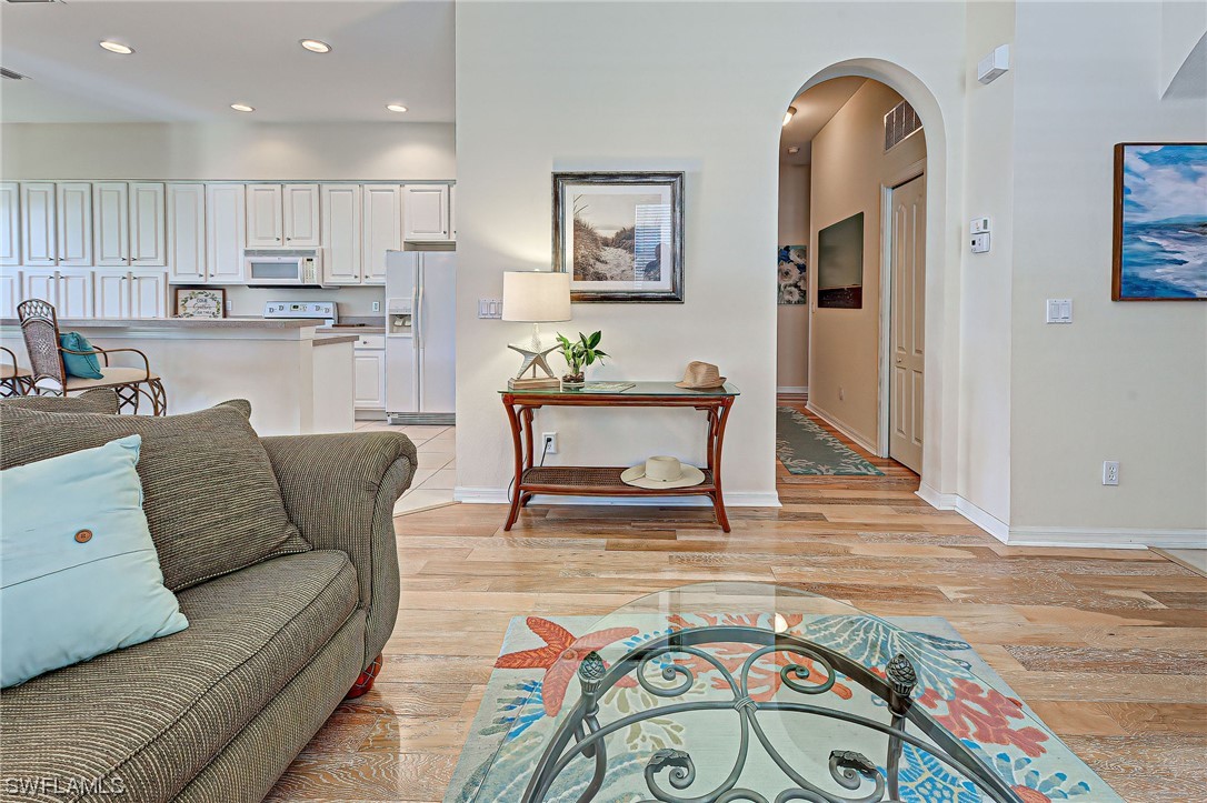 604 Ravinia Circle, Unit 604 Venice, FL 34292 - Photo 22 of 37 a living room with furniture and kitchen view