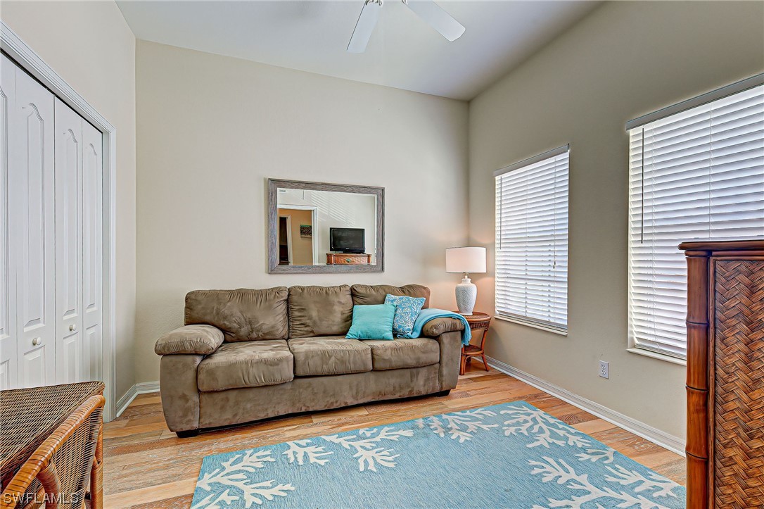 604 Ravinia Circle, Unit 604 Venice, FL 34292 - Photo 25 of 37 a living room with furniture and a window