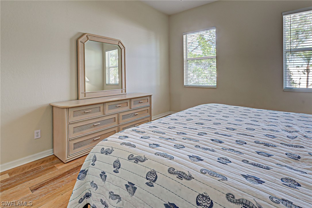 604 Ravinia Circle, Unit 604 Venice, FL 34292 - Photo 28 of 37 a bedroom with a bed and a window