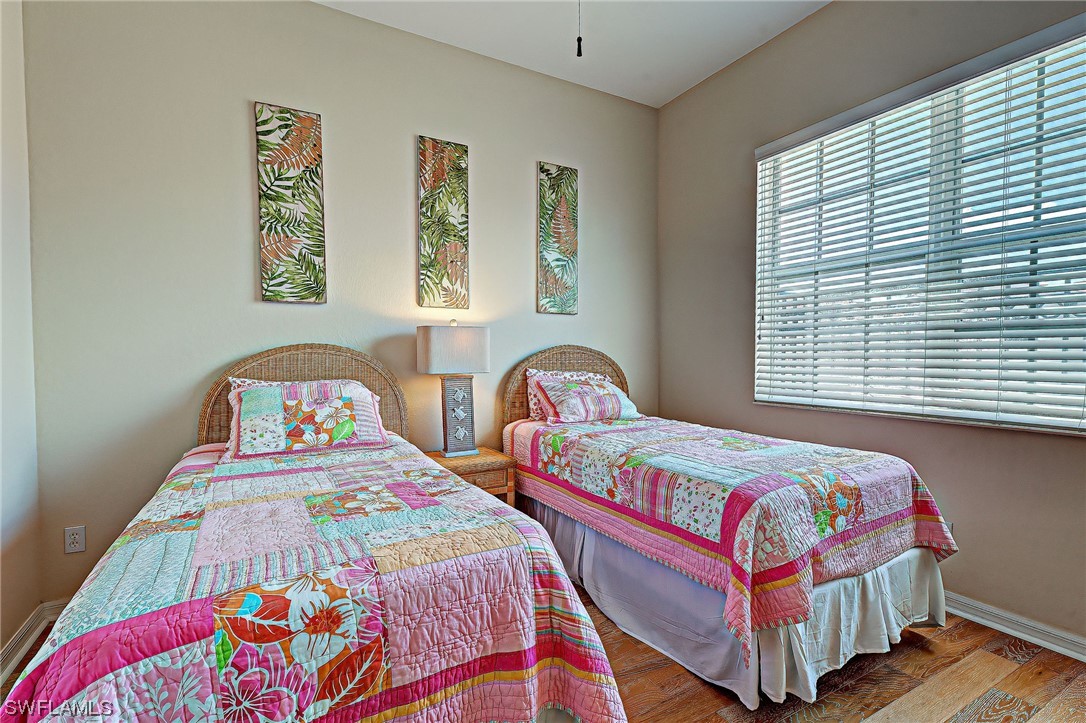 604 Ravinia Circle, Unit 604 Venice, FL 34292 - Photo 31 of 37 a bedroom with two beds and a window