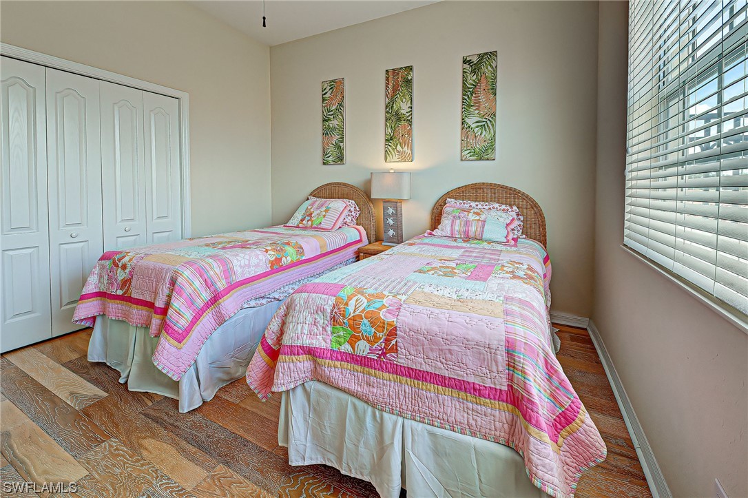 604 Ravinia Circle, Unit 604 Venice, FL 34292 - Photo 32 of 37 a bedroom with two beds and a window