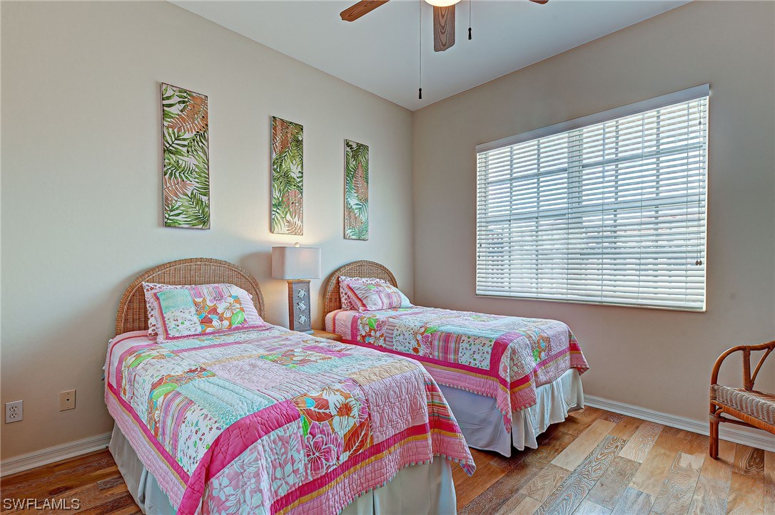 604 Ravinia Circle, Unit 604 Venice, FL 34292 - Photo 33 of 37 a bedroom with two beds and a window