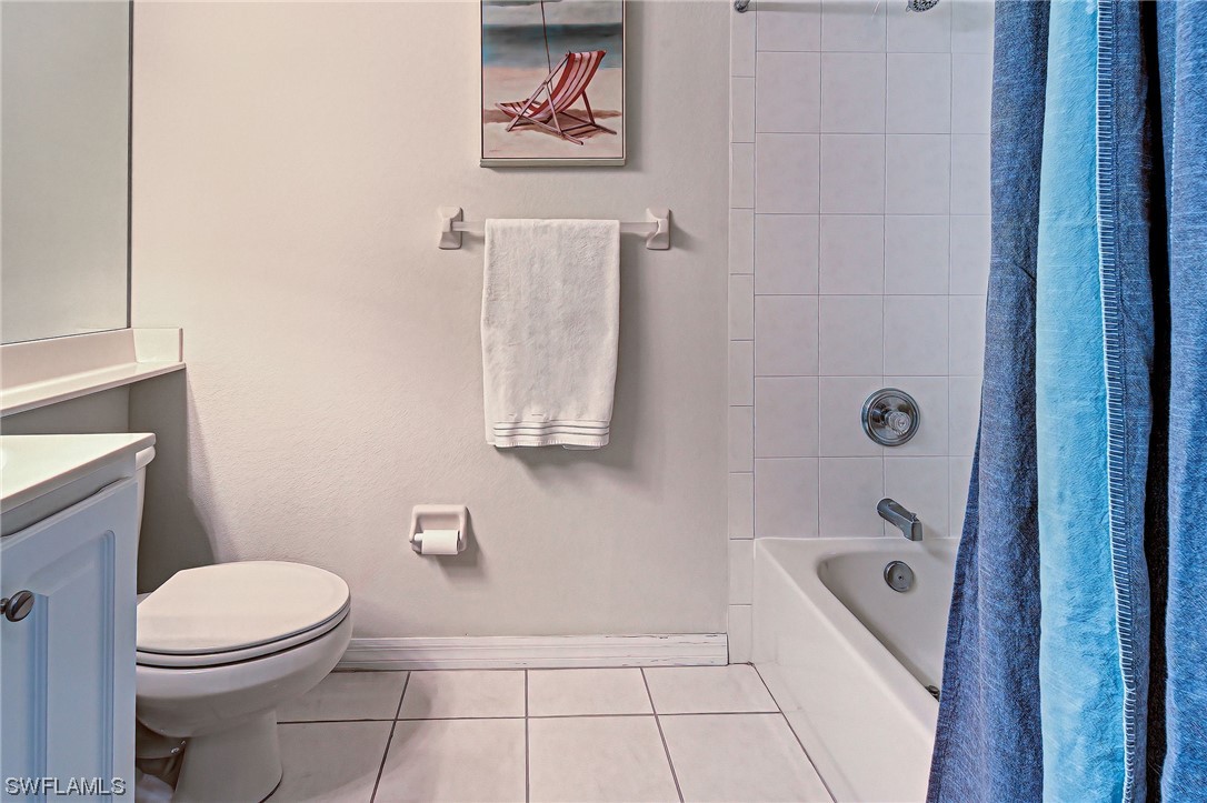 604 Ravinia Circle, Unit 604 Venice, FL 34292 - Photo 35 of 37 a bathroom with a toilet and a shower