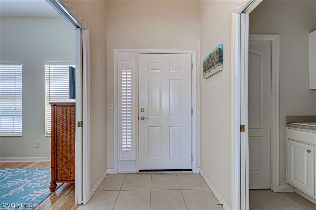604 Ravinia Circle, Unit 604 Venice, FL 34292 - Photo 37 of 37 a view of a hallway with a door and bedroom