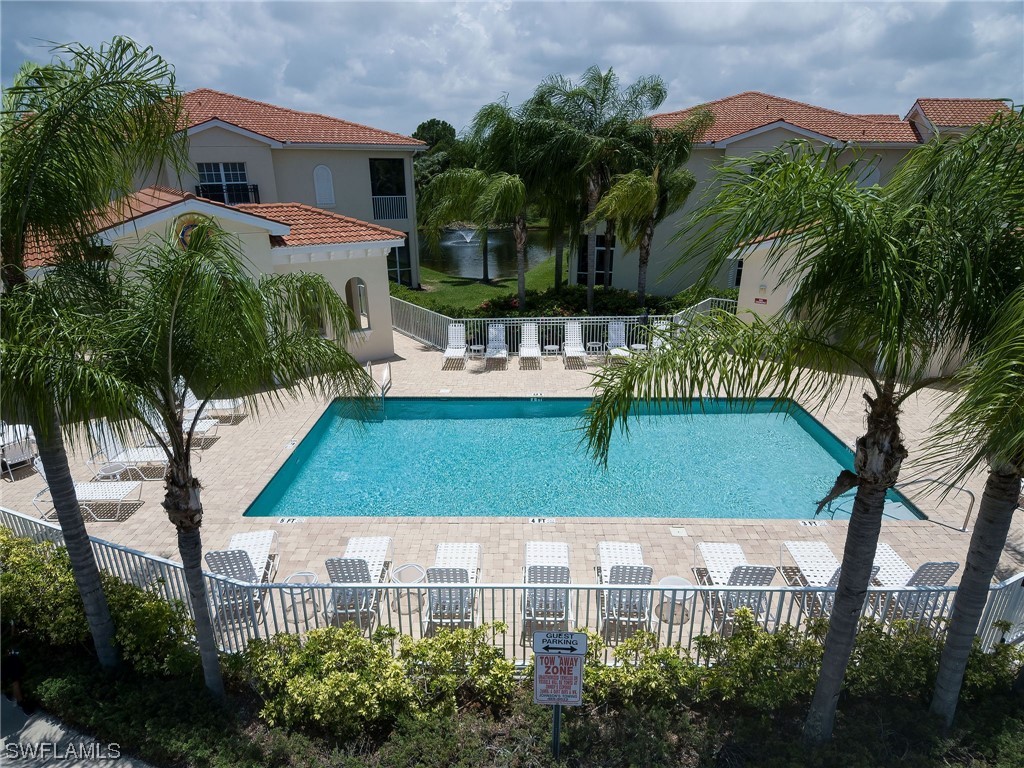 604 Ravinia Circle, Unit 604 Venice, FL 34292 - Photo 5 of 37 a view of house with swimming pool and a yard