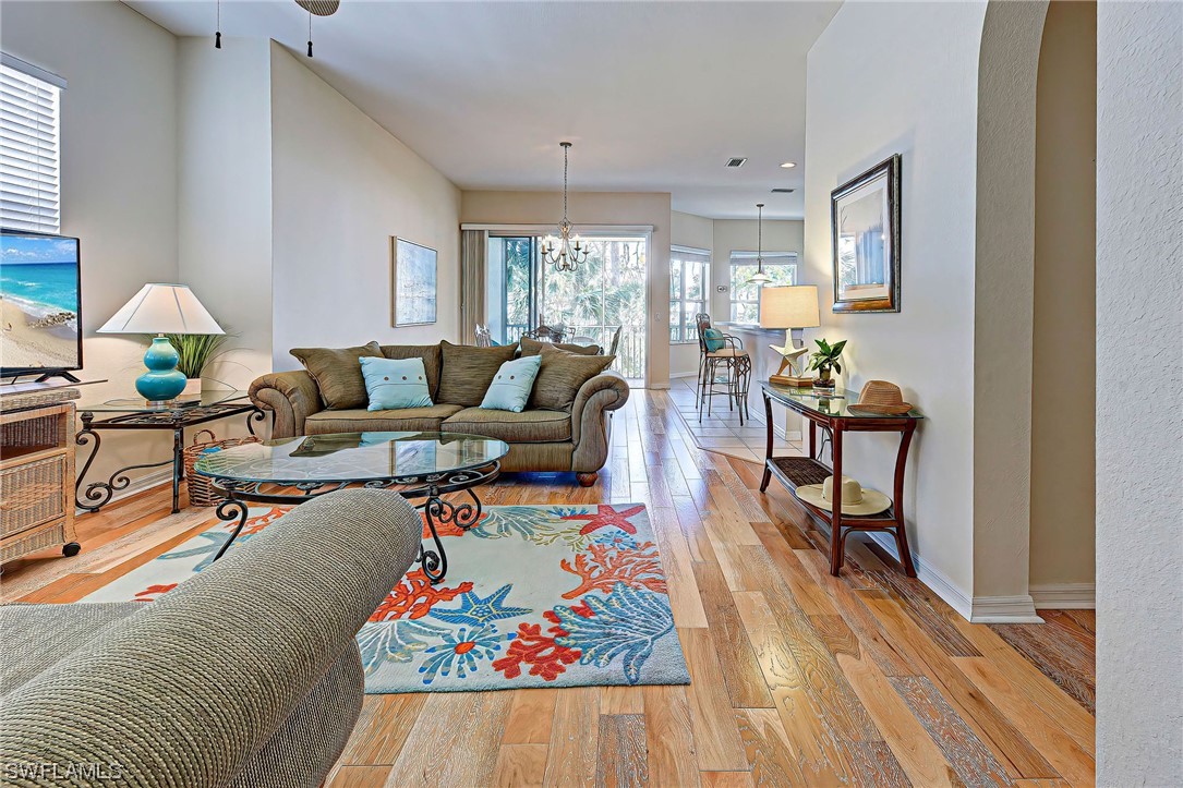 604 Ravinia Circle, Unit 604 Venice, FL 34292 - Photo 9 of 37 a living room with furniture and a window