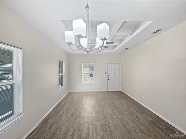 a very nice looking room with wooden floor