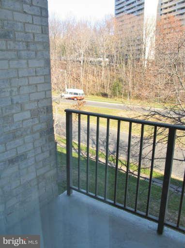 6137 Edsall Road, Unit J Alexandria, VA 22304 - Photo 11 of 13 a bathroom with a glass door