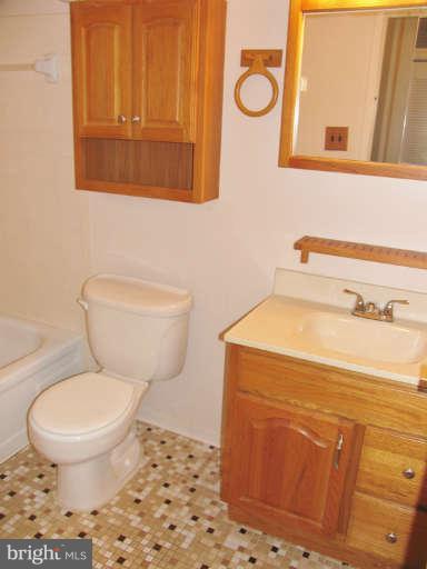 6137 Edsall Road, Unit J Alexandria, VA 22304 - Photo 7 of 13 a bathroom with a toilet and a sink