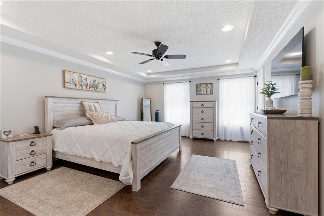 166 Amberwood Drive Anderson, SC 29621 - Photo 13 of 38 This spacious bedroom features ample natural light and elegant crown molding, creating a serene retreat.