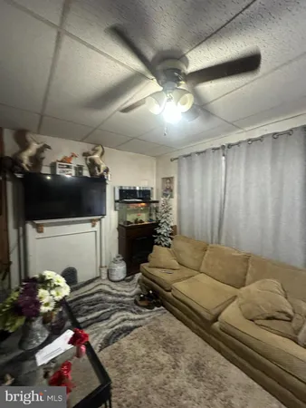 a view of a living room and a chandelier