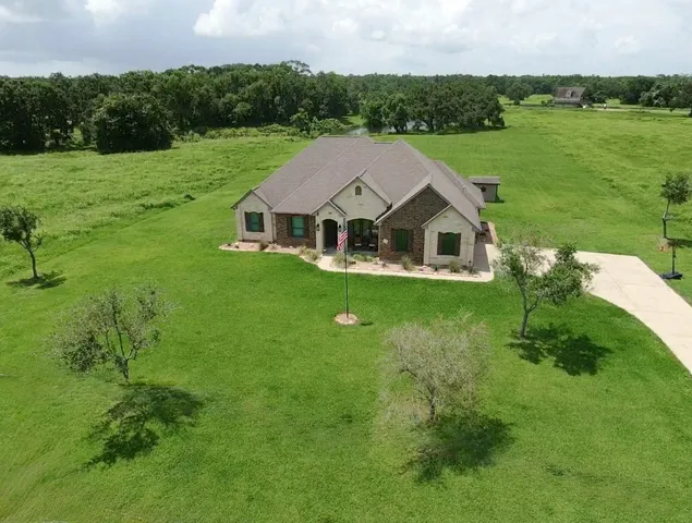 a view of a house with a big yard