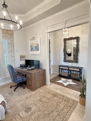 a living room with furniture and a mirror