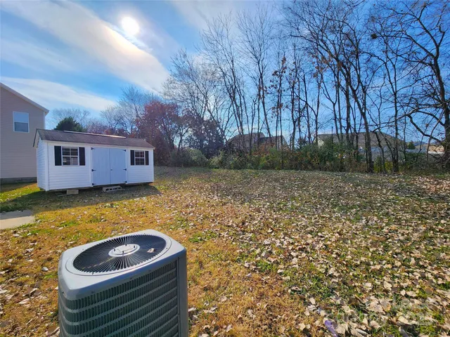 a backyard of a house with lots of green space