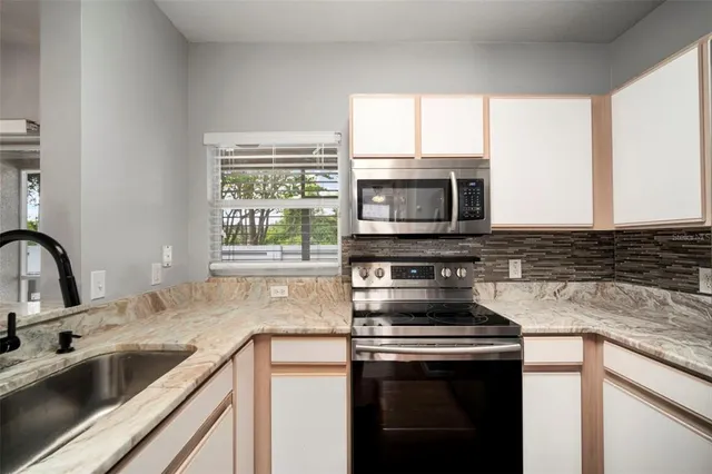 a bathroom with a toilet a sink and view