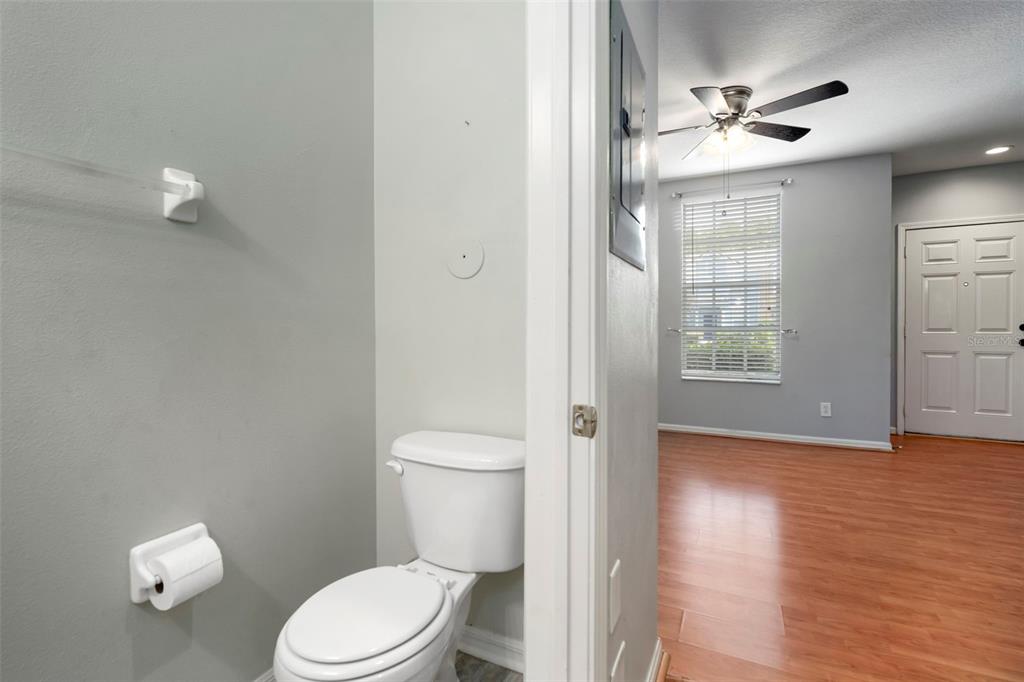 1231 Charlesworth Drive Wesley Chapel, FL 33543 - Photo 16 of 41 a bathroom with a toilet a sink and view