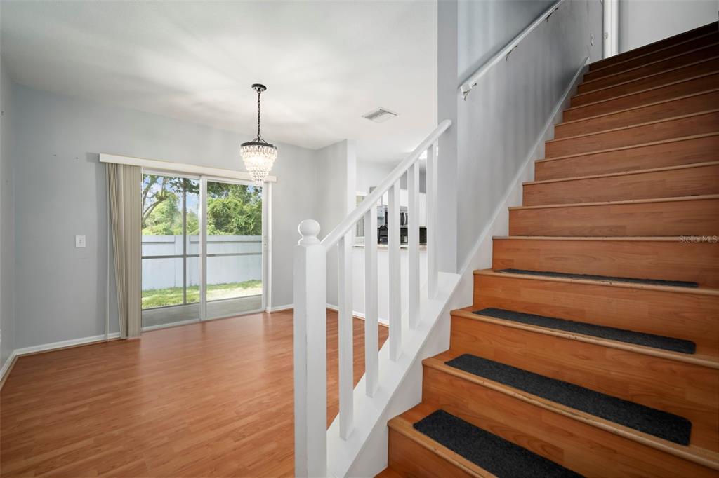 1231 Charlesworth Drive Wesley Chapel, FL 33543 - Photo 21 of 41 a view of entryway and hall with wooden floor