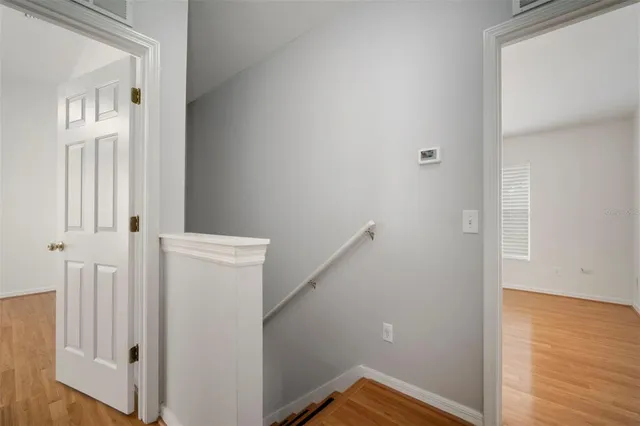a bathroom with a bathtub shower sink vanity mirror and toilet