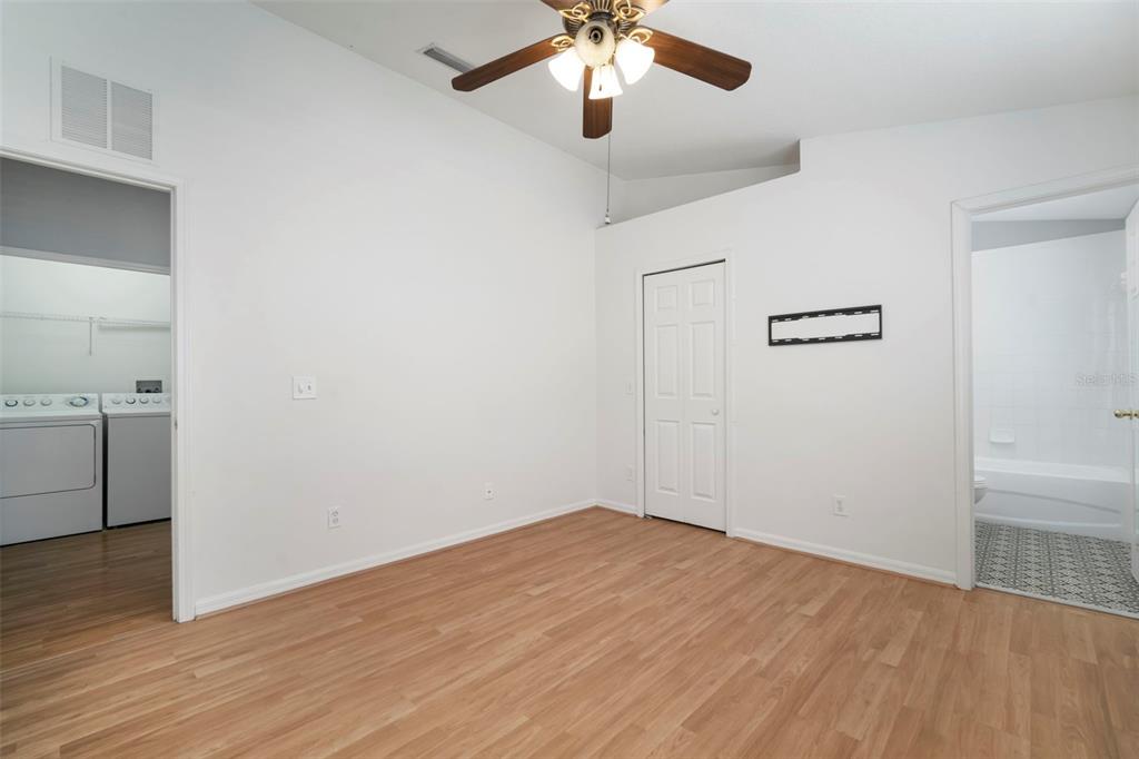 1231 Charlesworth Drive Wesley Chapel, FL 33543 - Photo 26 of 41 a view of empty room with wooden floor