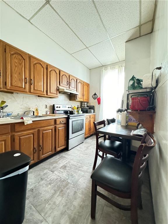 451 73rd Street Brooklyn, NY 11209 - Photo 12 of 16 a kitchen with a sink appliances and cabinets