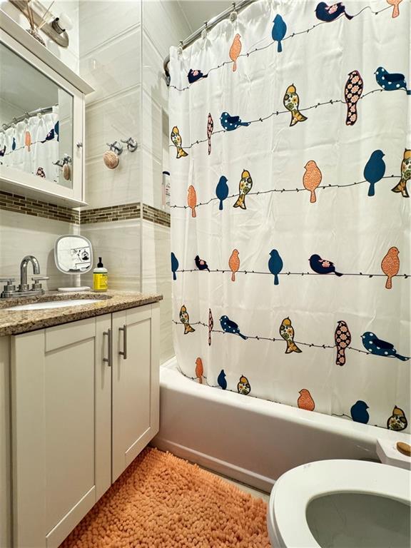 451 73rd Street Brooklyn, NY 11209 - Photo 13 of 16 a bathroom with a bathtub and a sink