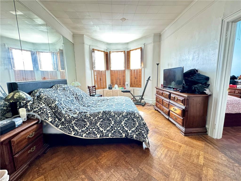 451 73rd Street Brooklyn, NY 11209 - Photo 3 of 16 a living room with furniture and a flat screen tv