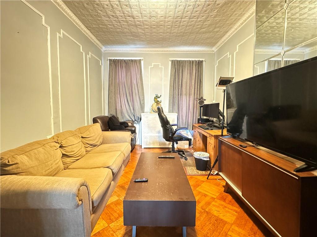 451 73rd Street Brooklyn, NY 11209 - Photo 8 of 16 a bed room with a bed tv and a window