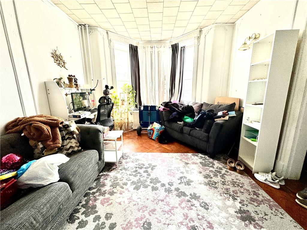 451 73rd Street Brooklyn, NY 11209 - Photo 9 of 16 a living room with furniture and a large window