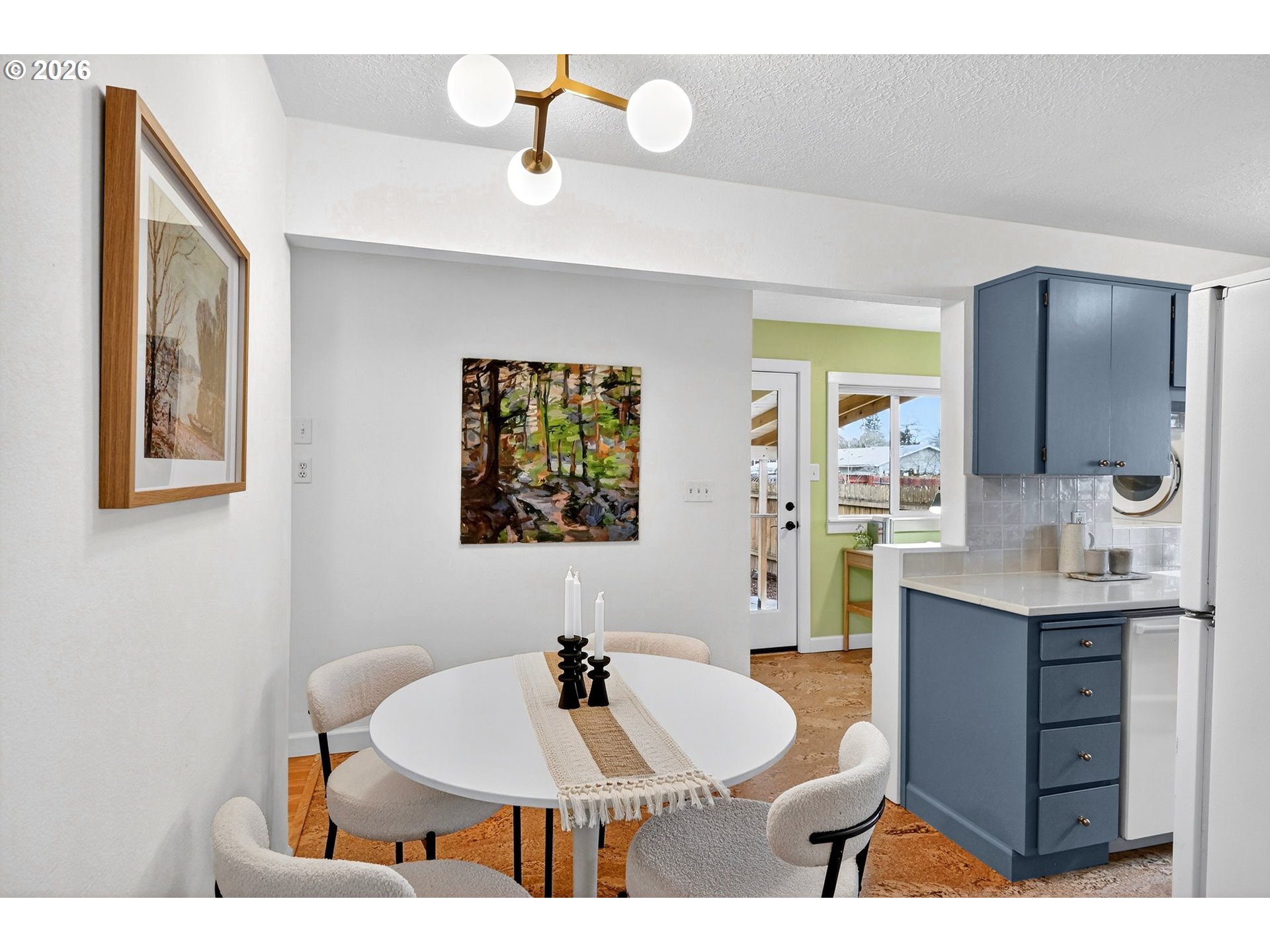6128 Southeast Reedway Street Portland, OR 97206 - Photo 11 of 40 a dining room with a table and chairs